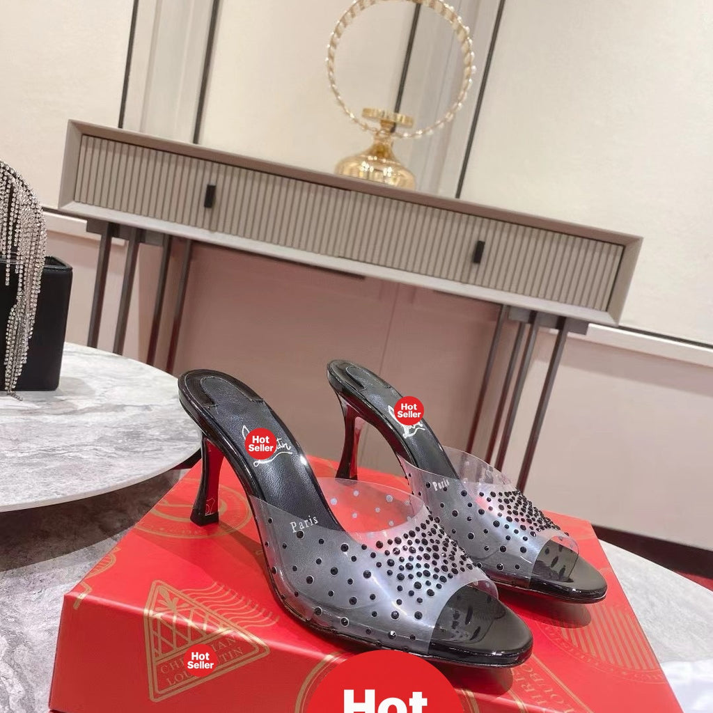 Black open-toe high-heeled mules with transparent strap detail; 8cm heel.