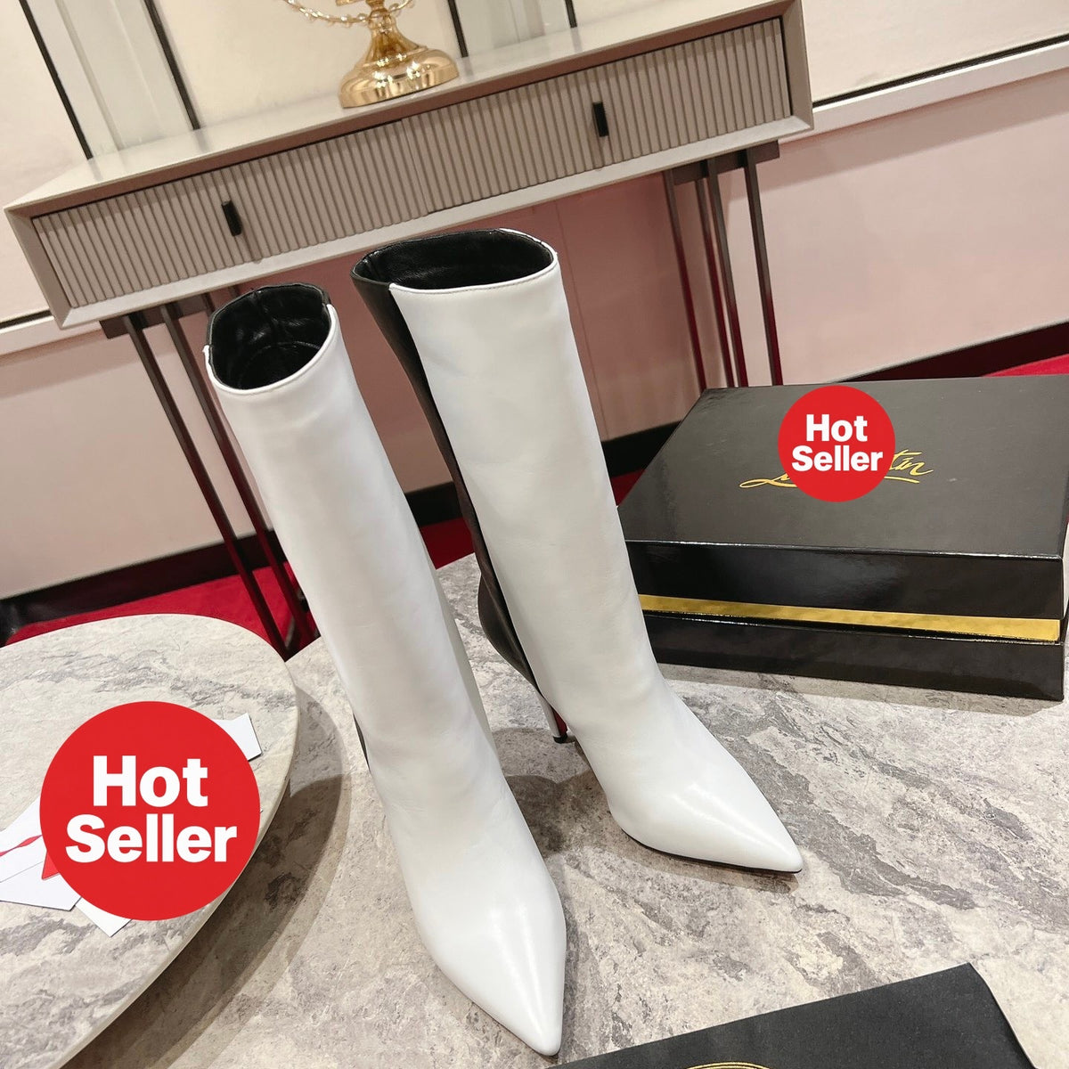 Paneled leather tall boots with a distinctive design; 10cm heel.