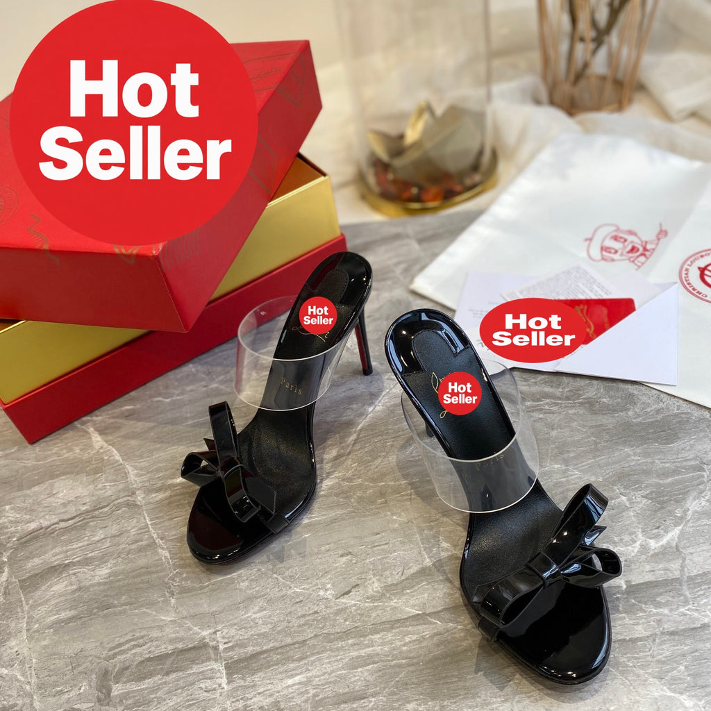 Black high-heeled mules with butterfly-shaped transparent detail; 10cm heel.