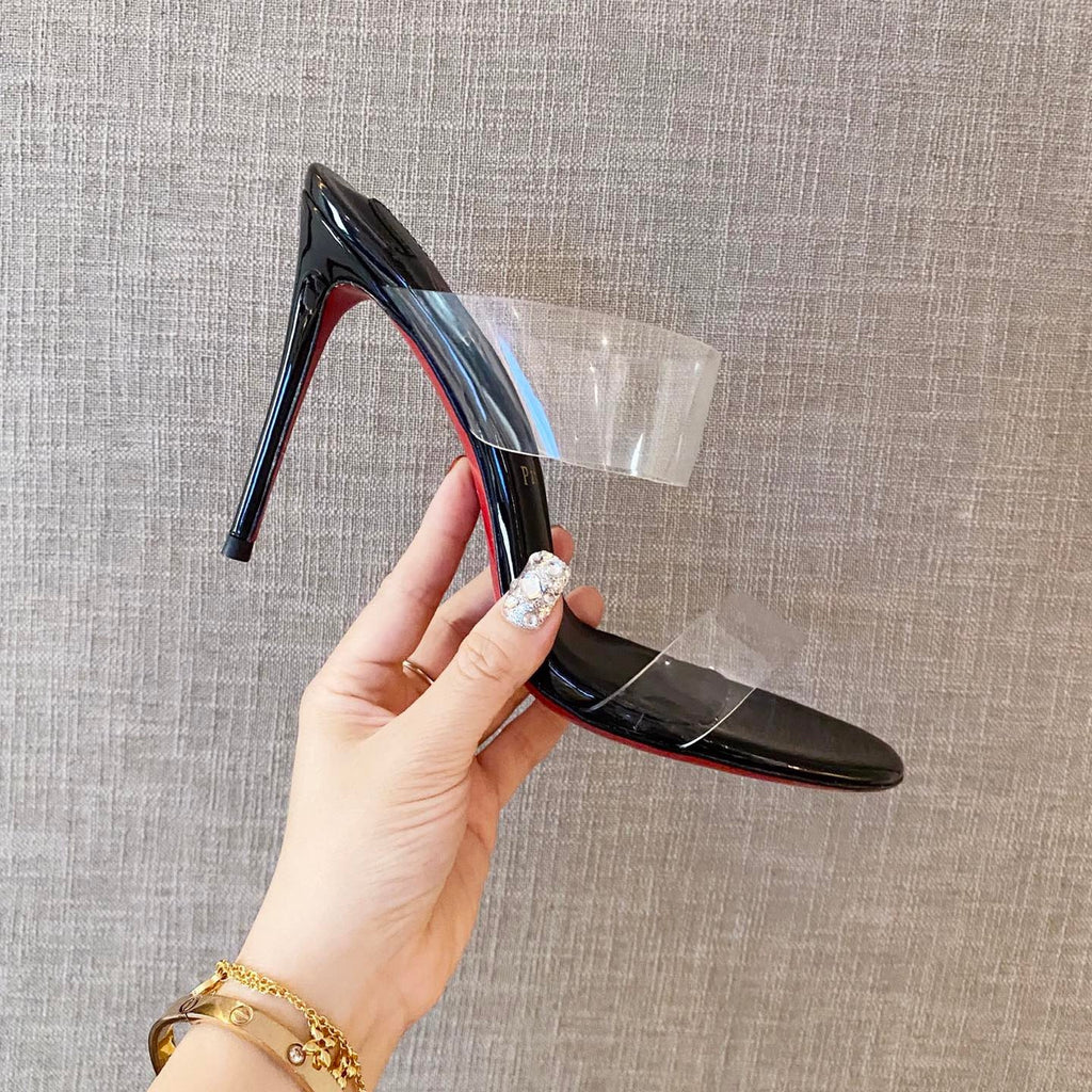 Black high-heeled mules with transparent detailing; 10cm heel.