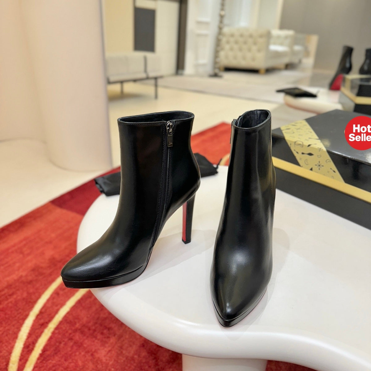 Black leather stiletto ankle boots, 12cm heel.