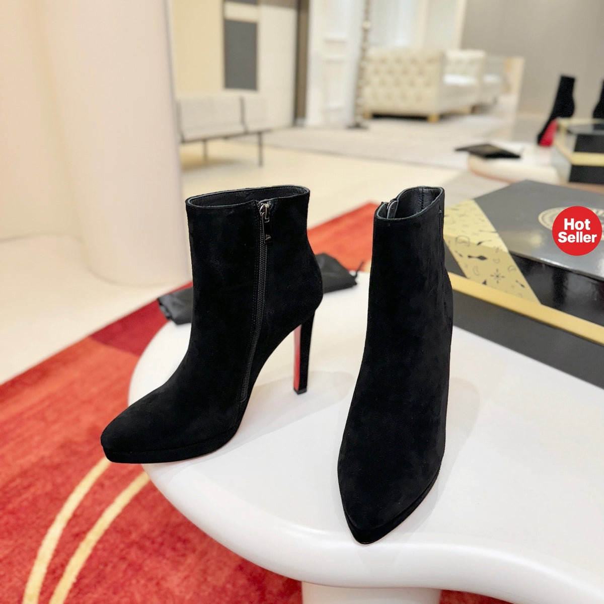 Black suede stiletto ankle boots, 12cm heel.