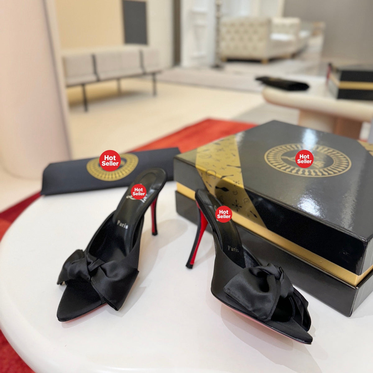 Black bow-detail high-heeled mules, 10cm heel.