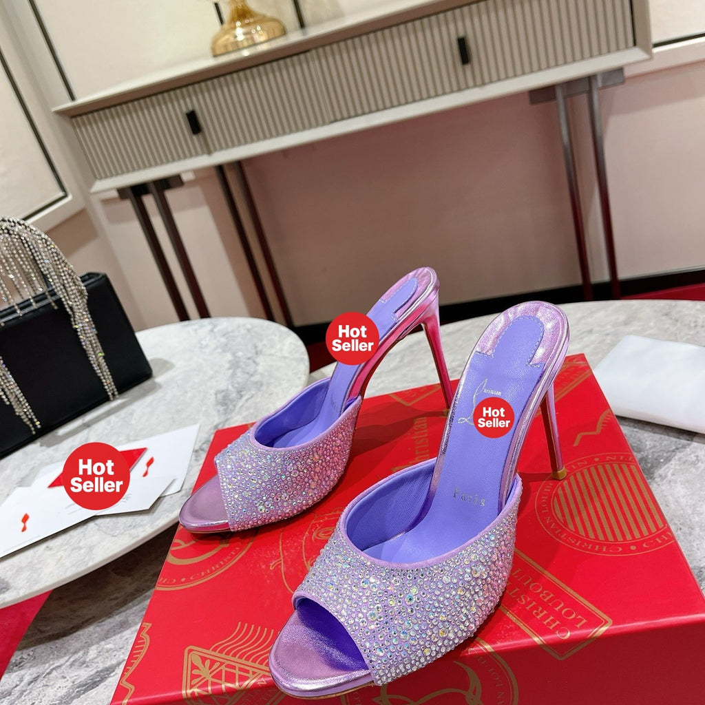 Purple peep-toe high-heeled mules with rhinestone embellishment; 10cm heel.