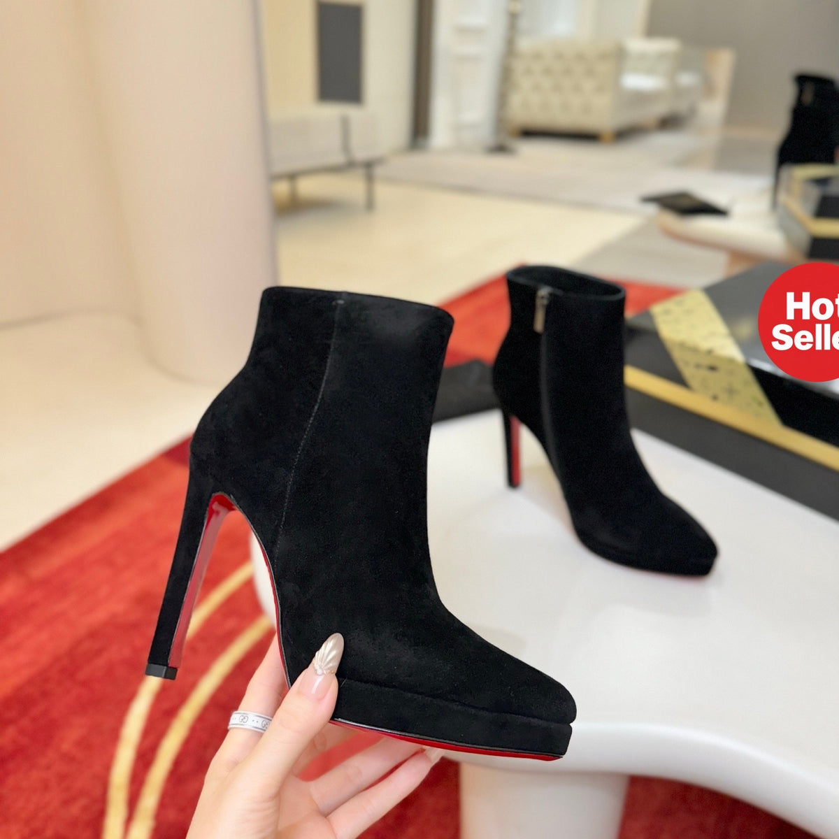 Black suede stiletto ankle boots, 12cm heel.