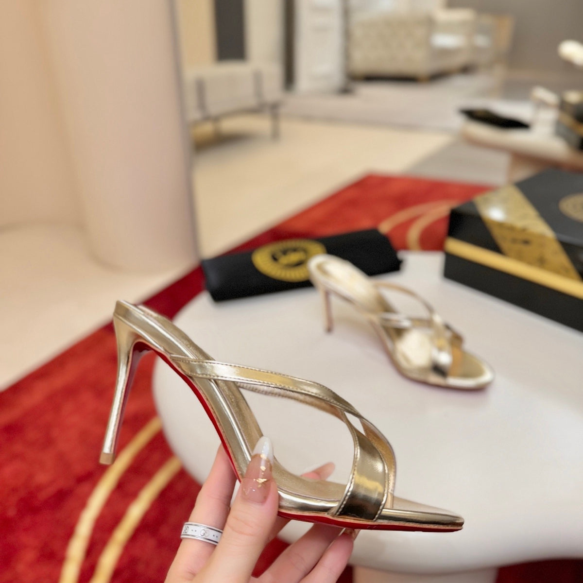 Criss-cross high-heeled mules