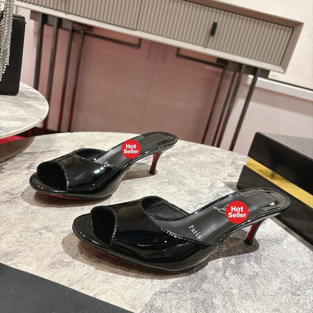 Black patent leather high-heeled mules, 8.5cm heel.
