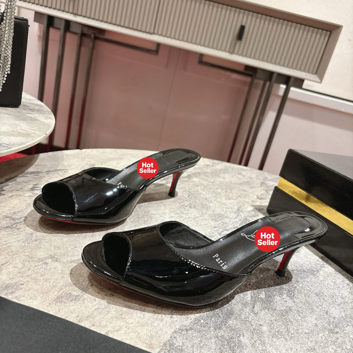 Black patent leather high-heeled mules, 8.5cm heel.