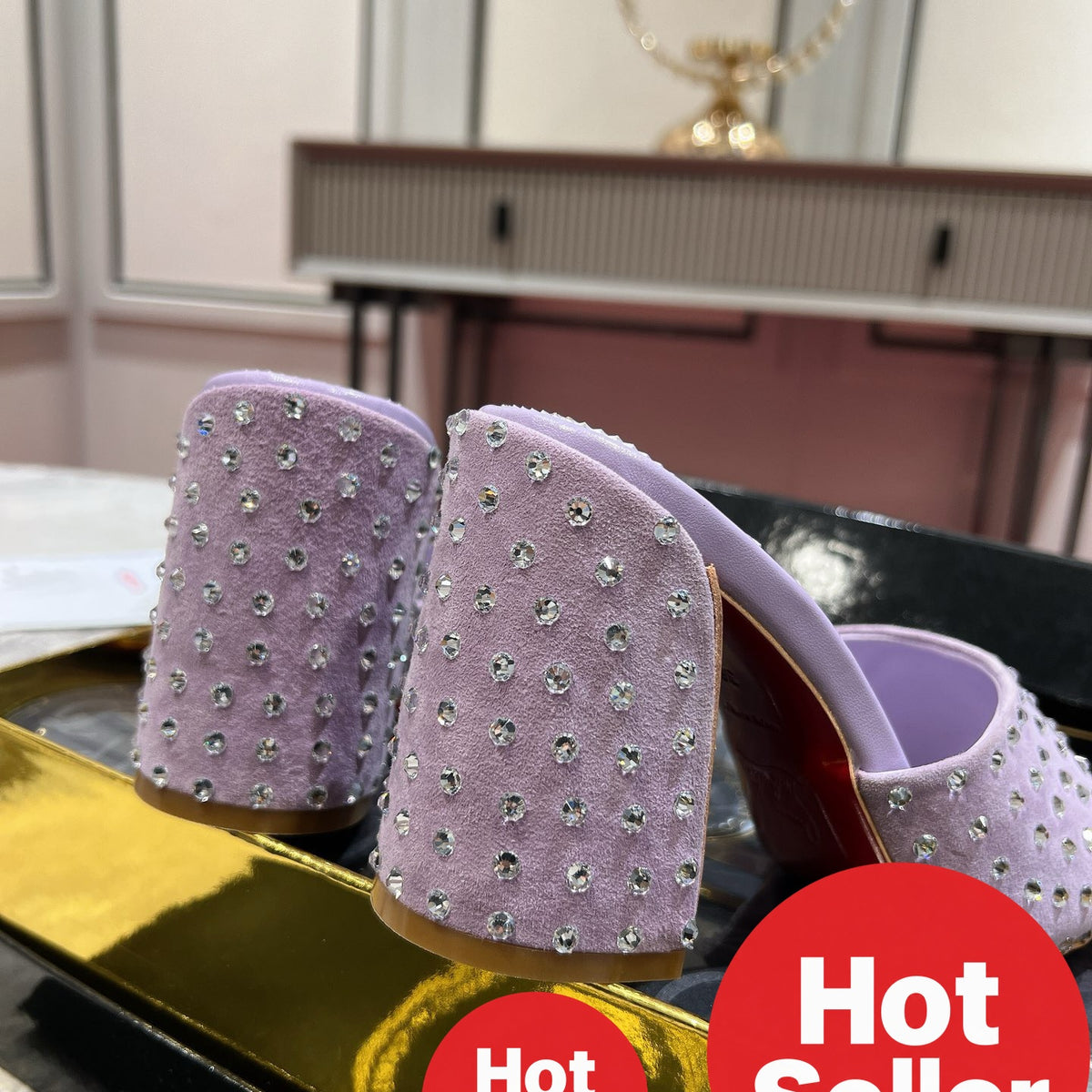 Chunky-heeled mules with purple rhinestone embellishment; heel height: 8.5cm.