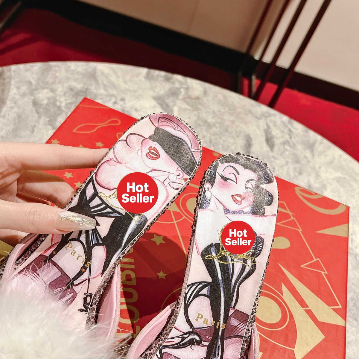 Stylish high-heeled mules with pom-poms; 10cm heel.