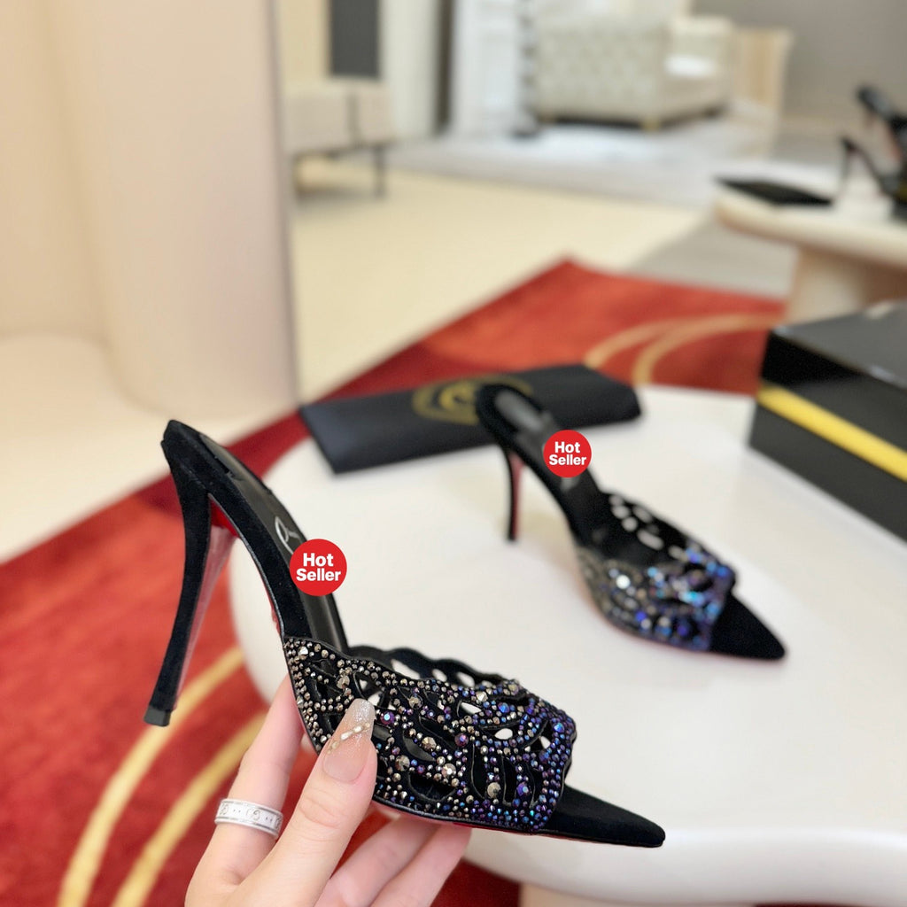 Black cutout high-heeled mules with all-over pavé crystals; 10cm heel.