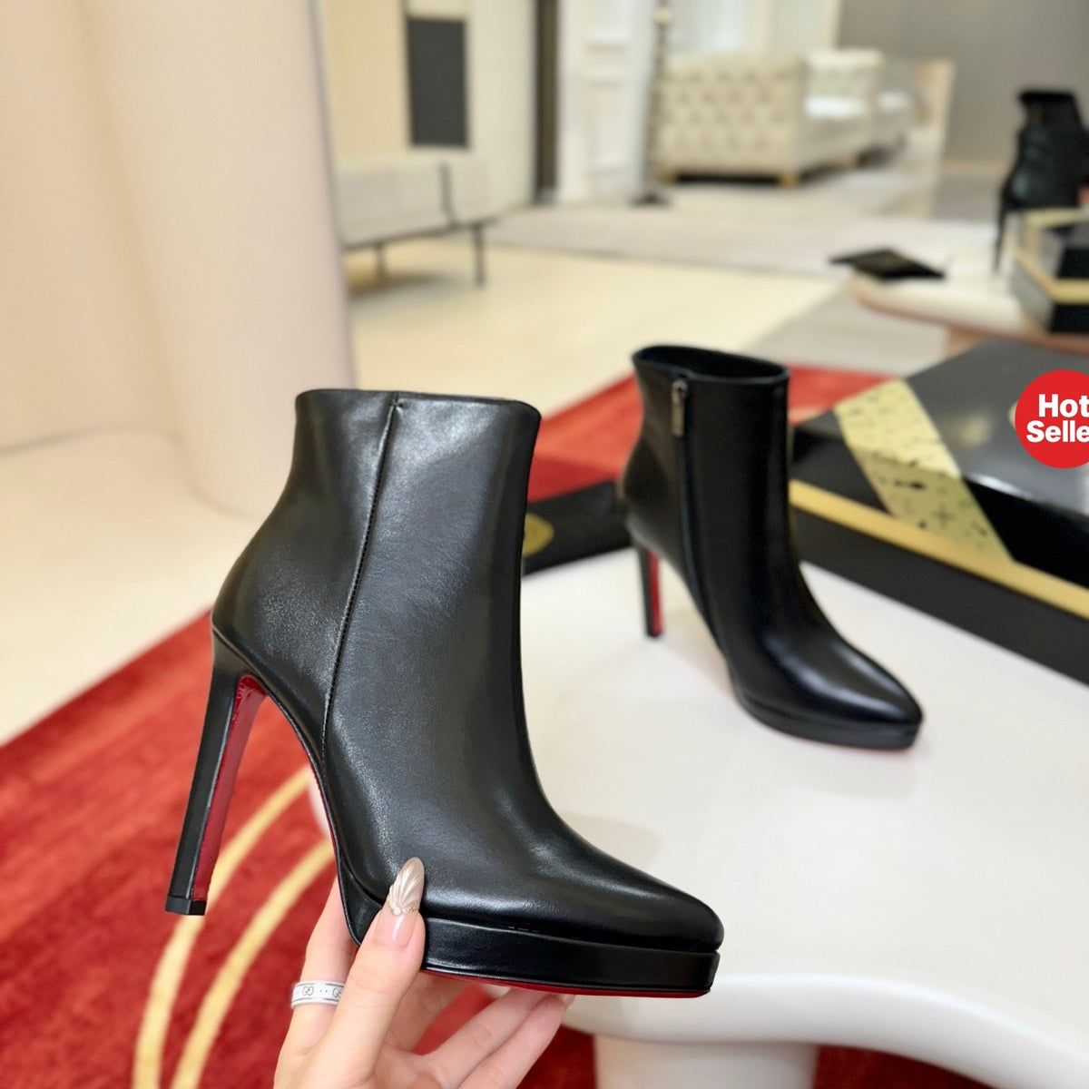 Black leather stiletto ankle boots, 12cm heel.