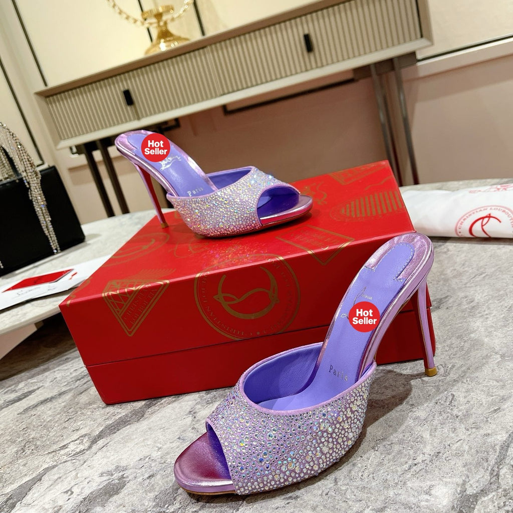 Purple peep-toe high-heeled mules with rhinestone embellishment; 10cm heel.