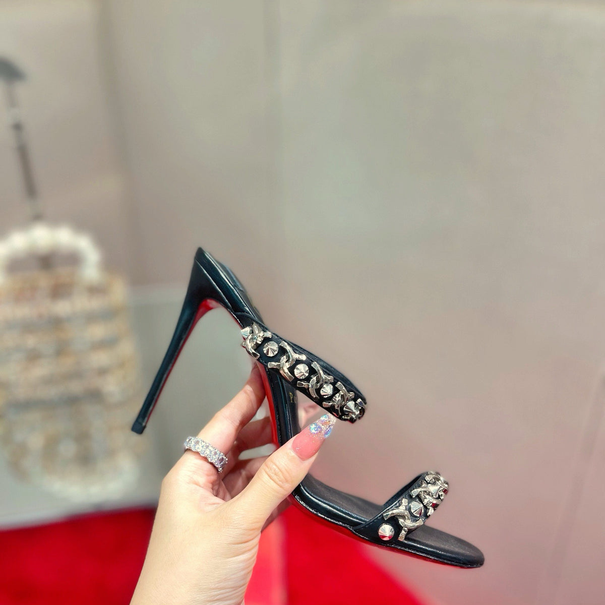 Chain-detail high-heeled mules, 10cm heel.