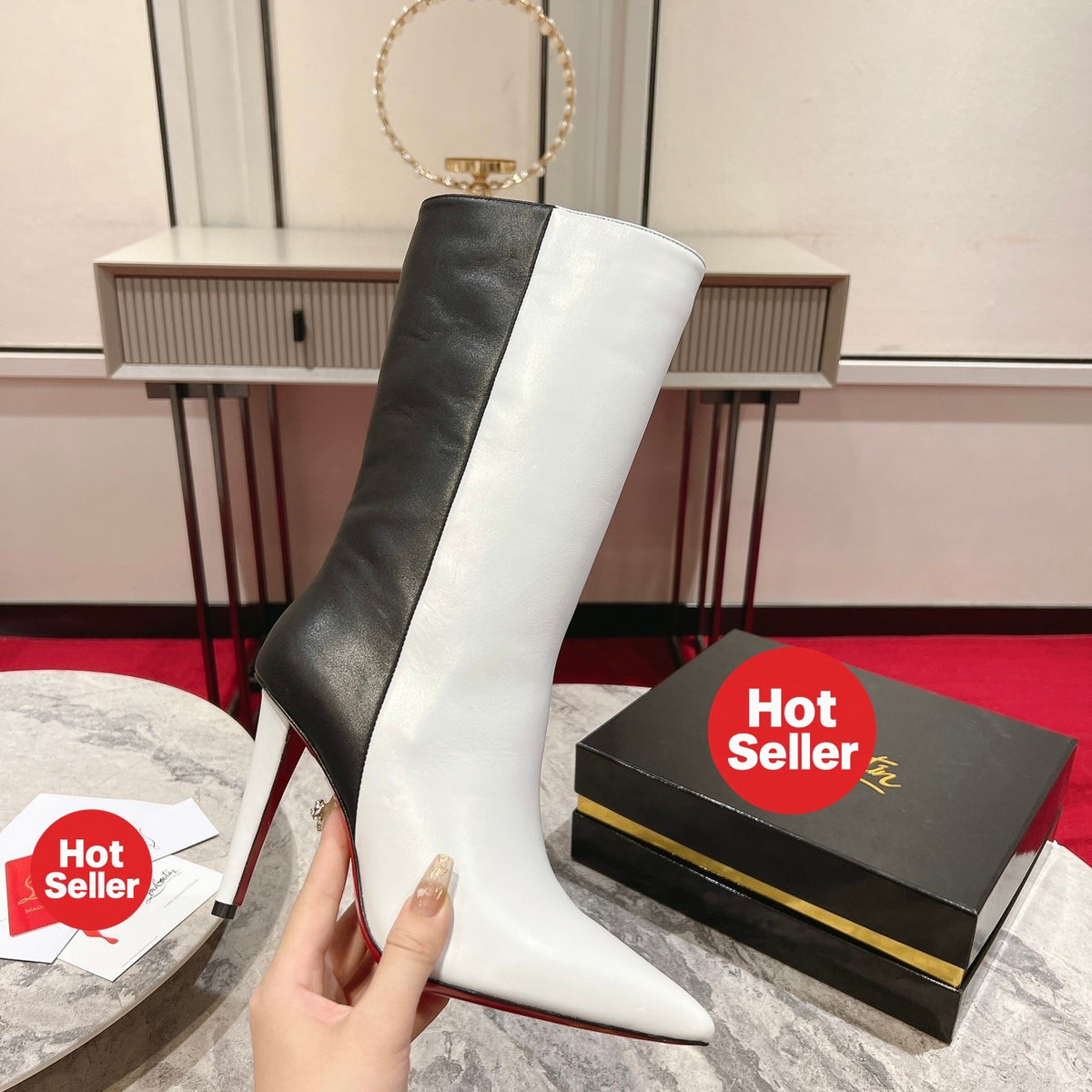 Paneled leather tall boots with a distinctive design; 10cm heel.
