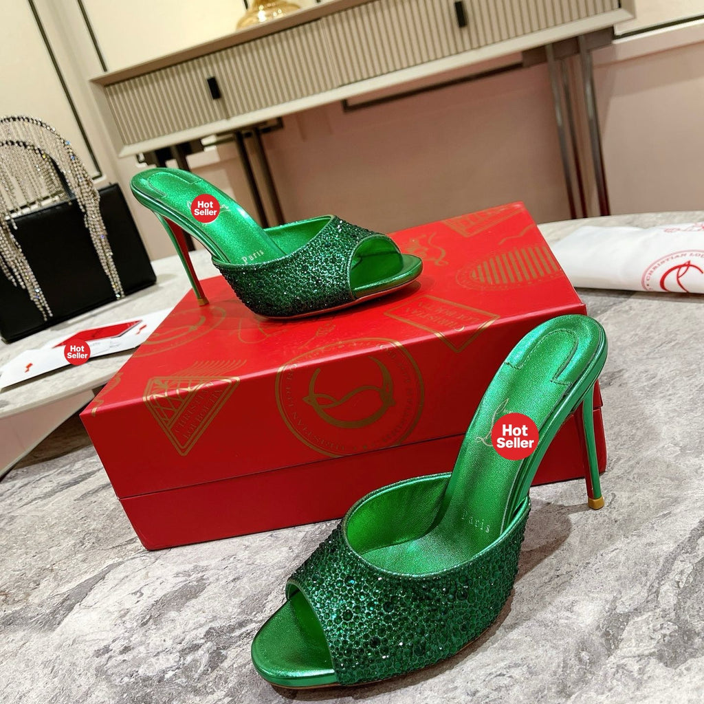 Green peep-toe high-heeled mules with rhinestone embellishment; 10cm heel.
