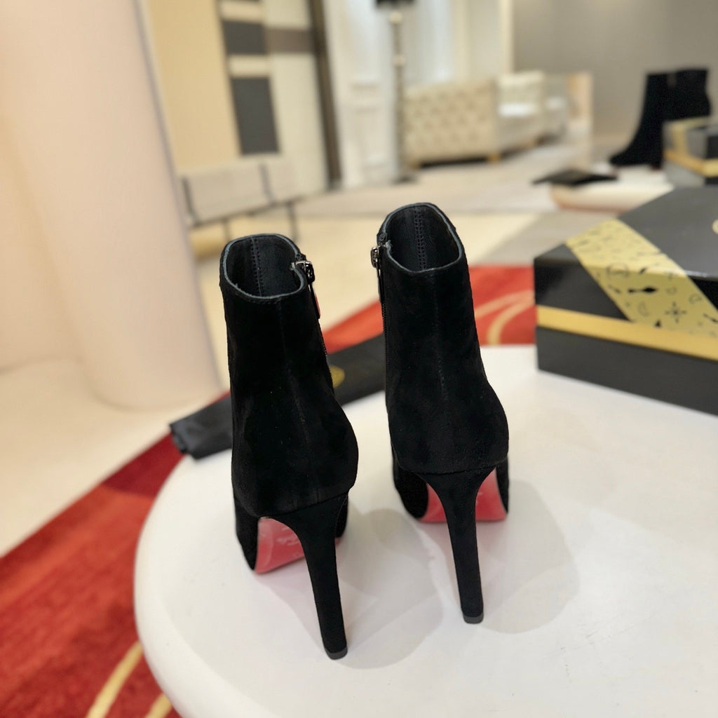 Black suede stiletto ankle boots, 12cm heel.