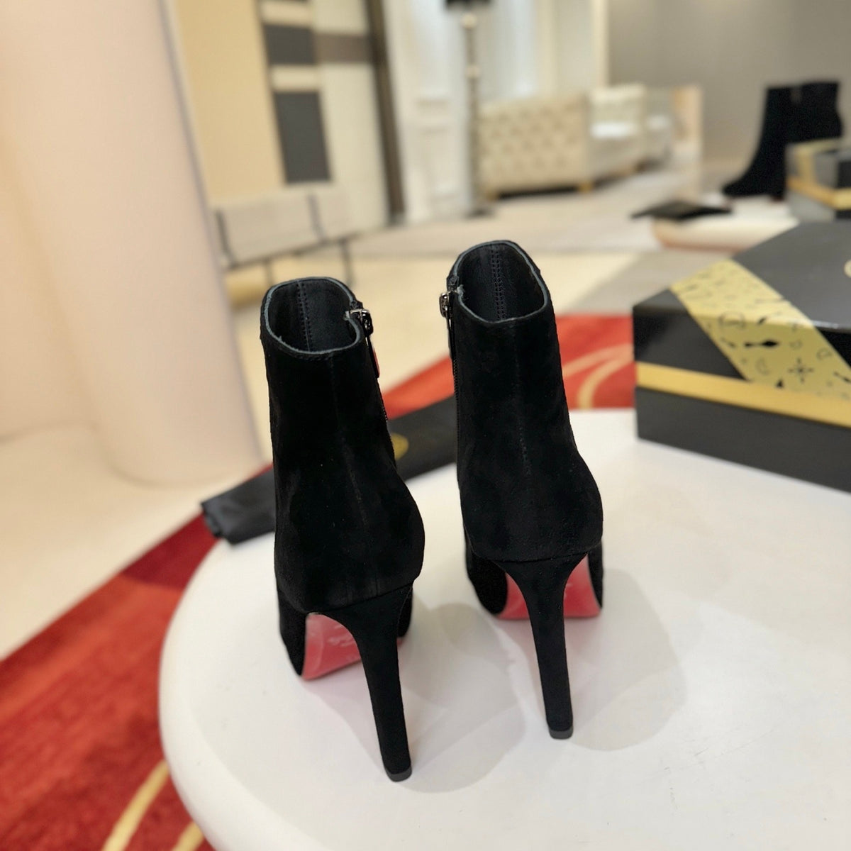 Black suede stiletto ankle boots, 12cm heel.