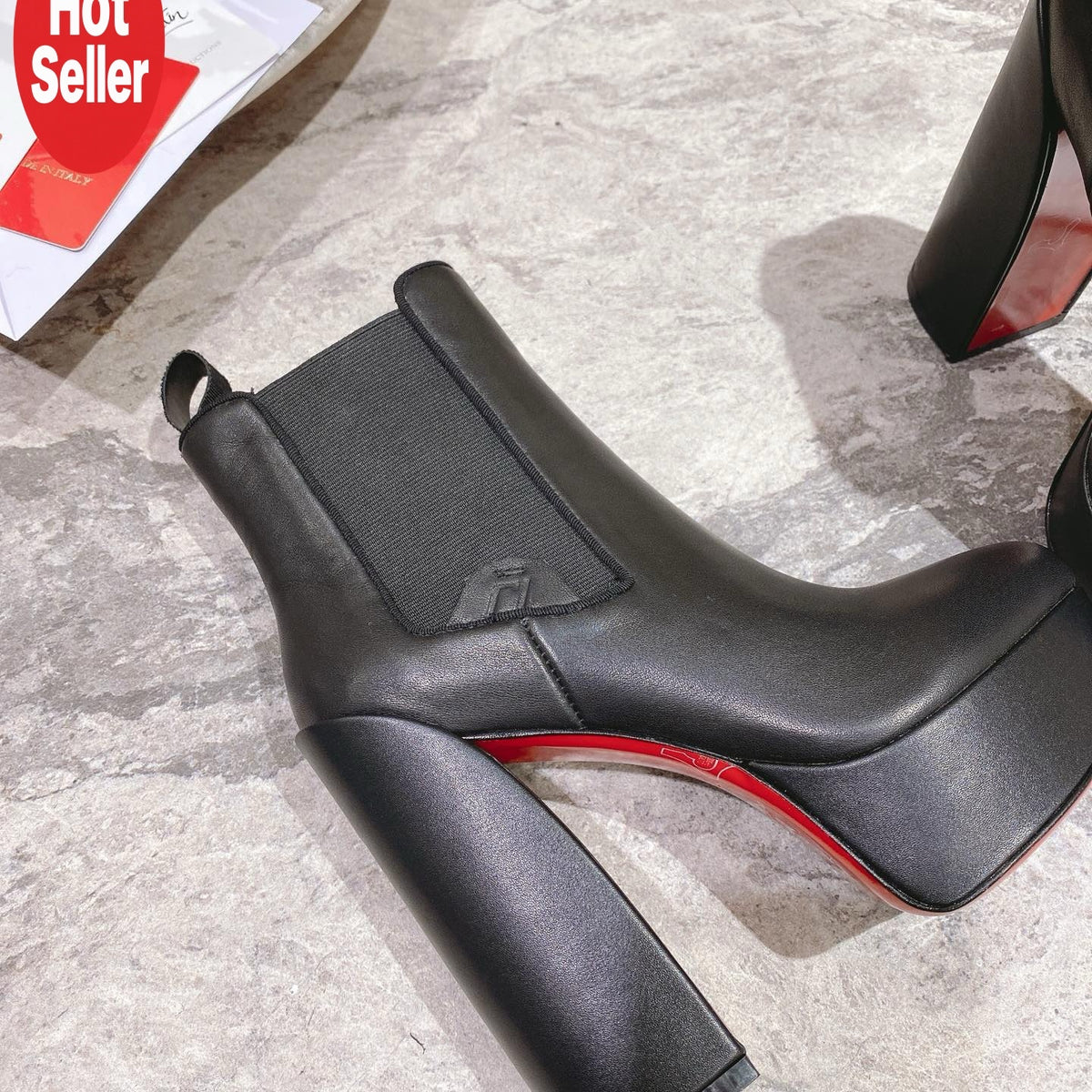 Black calfskin ankle boots with 13cm stiletto heels.