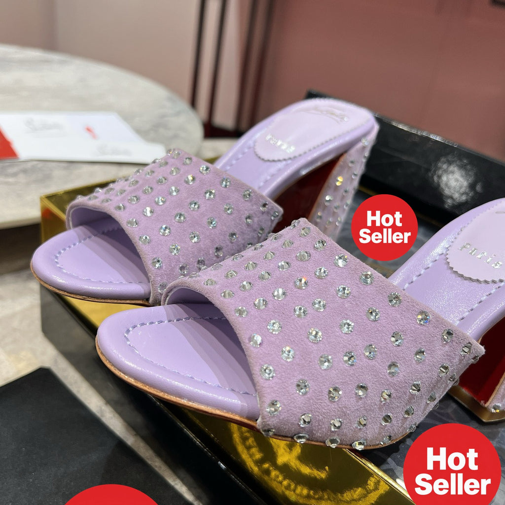 Chunky-heeled mules with purple rhinestone embellishment; heel height: 8.5cm.