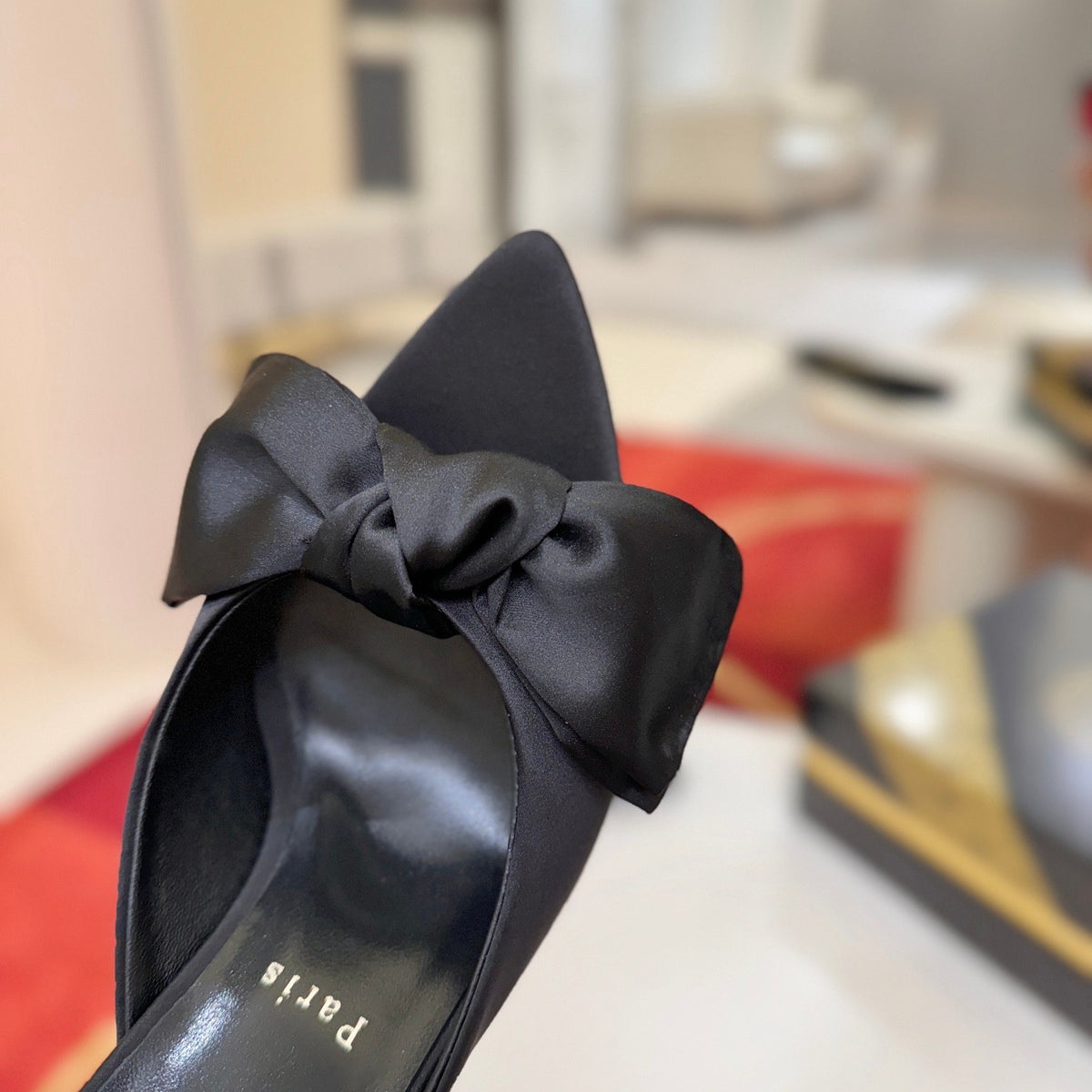 Black bow-detail high-heeled mules, 10cm heel.
