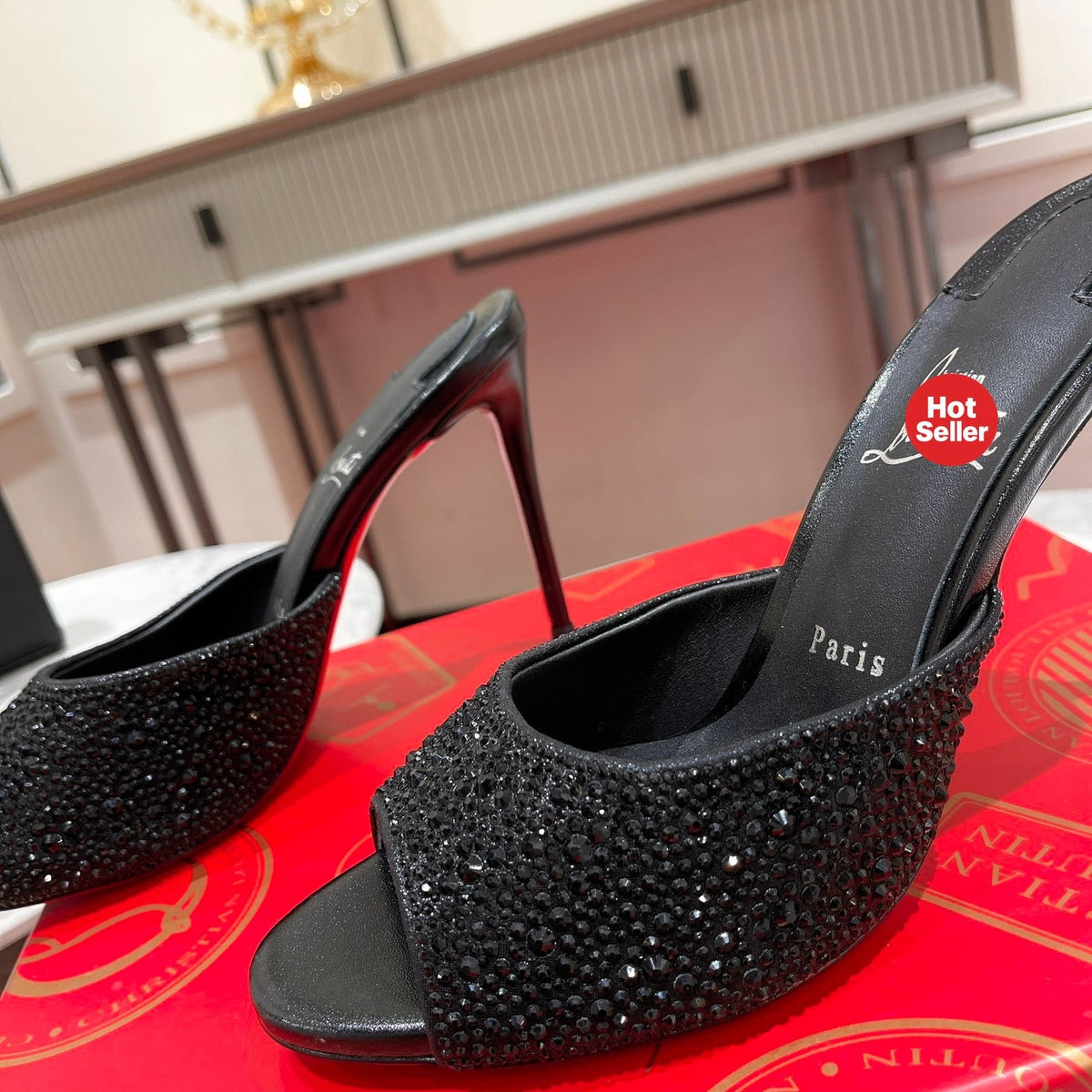Black peep-toe high-heeled mules with rhinestone embellishment; 10cm heel.