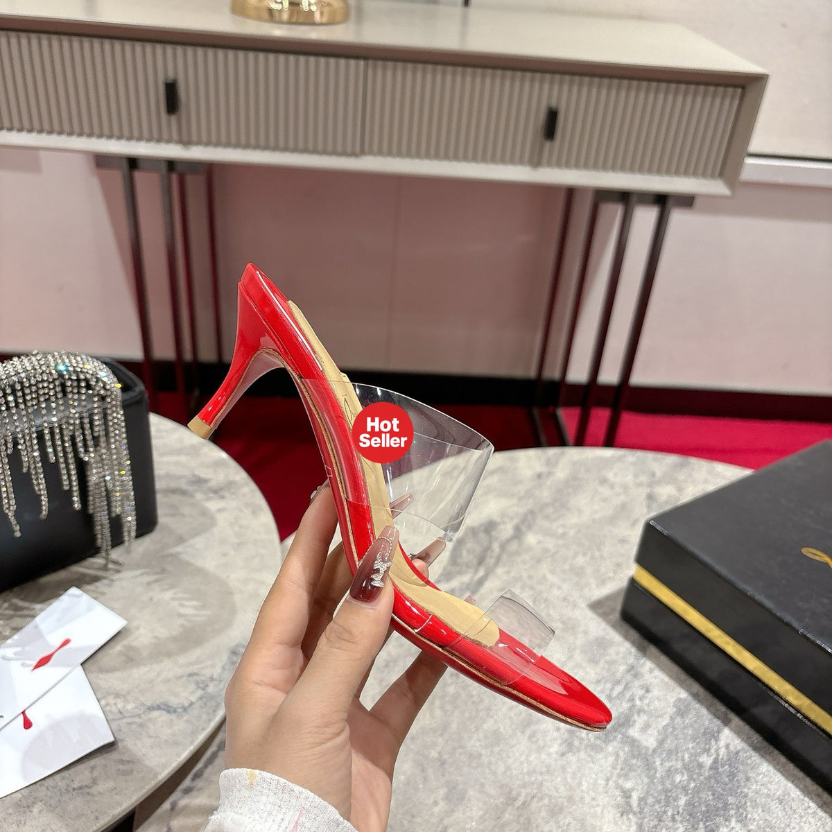 Red translucent high-heeled mules, 8.5cm heel.