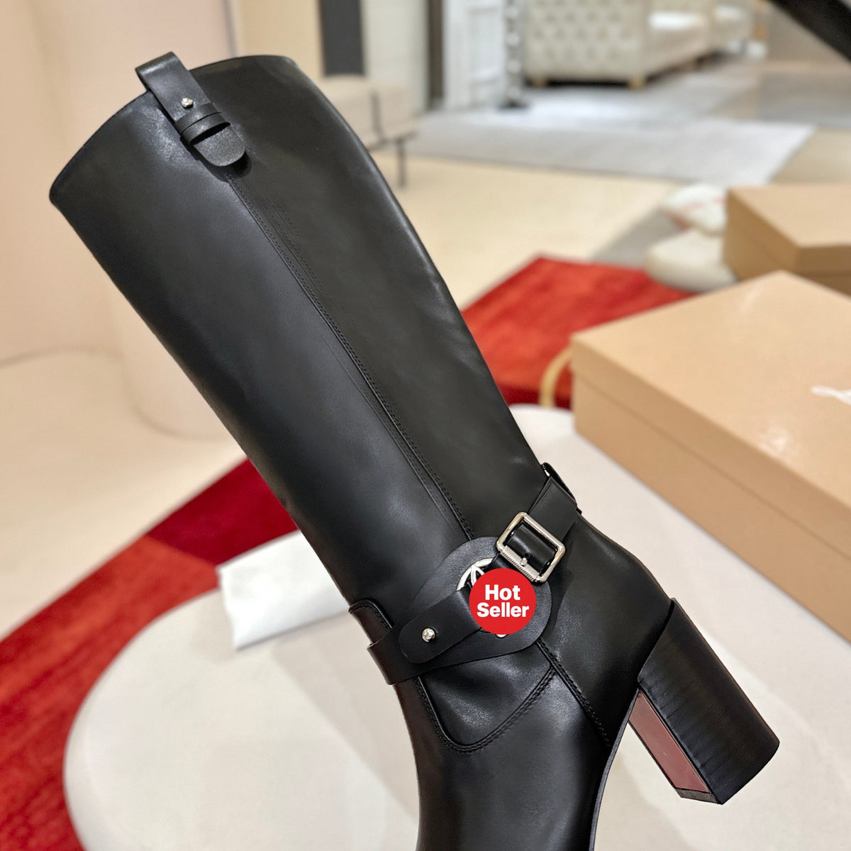 The boots feature a round-toe design and a 7cm heel.