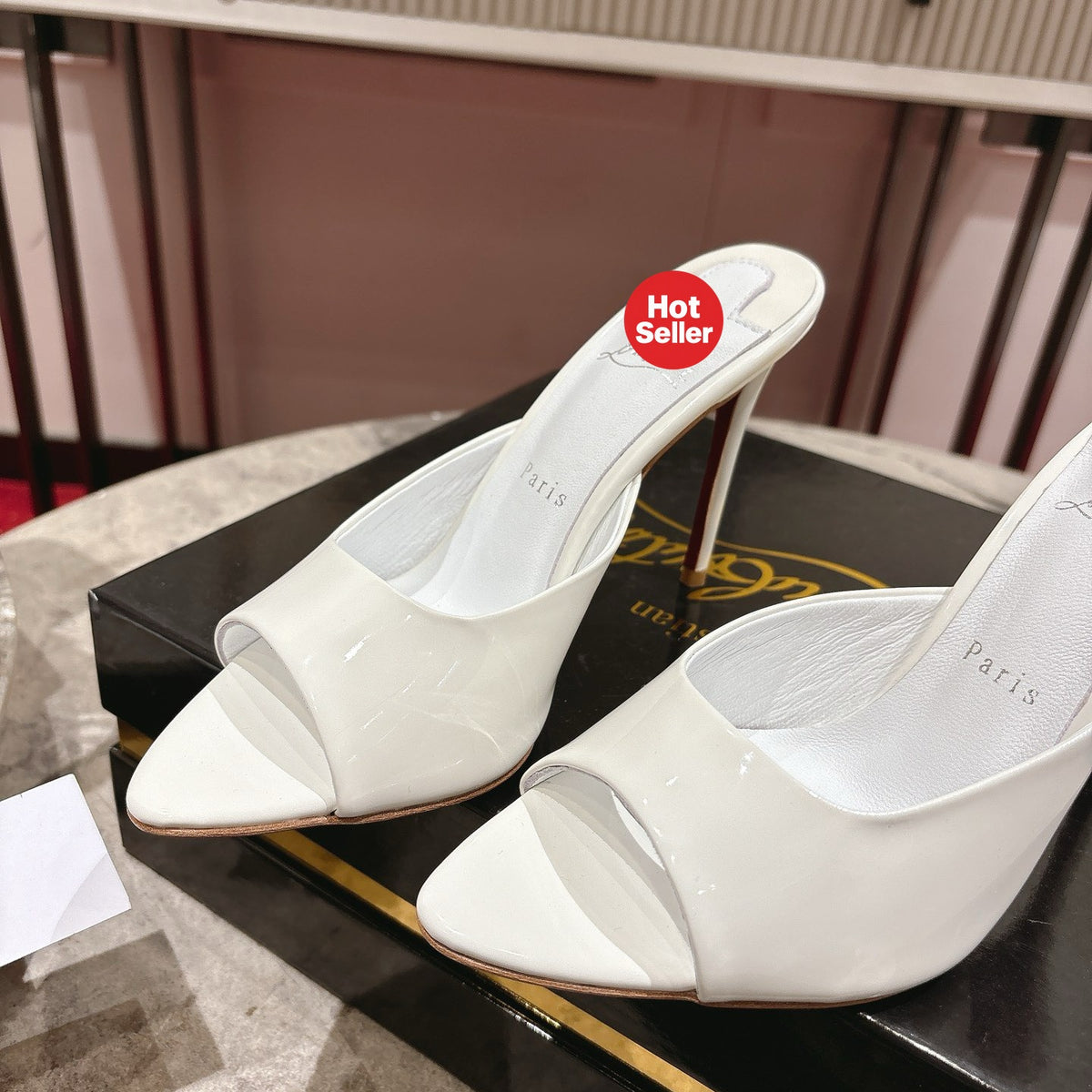 White pointed-toe patent leather high-heeled mules, 10cm heel.