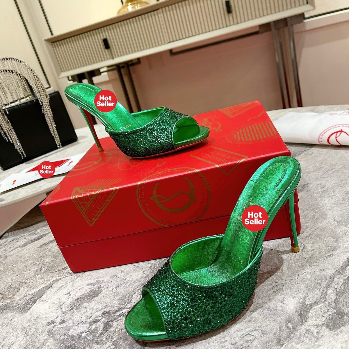 Green peep-toe high-heeled mules with rhinestone embellishment; 10cm heel.