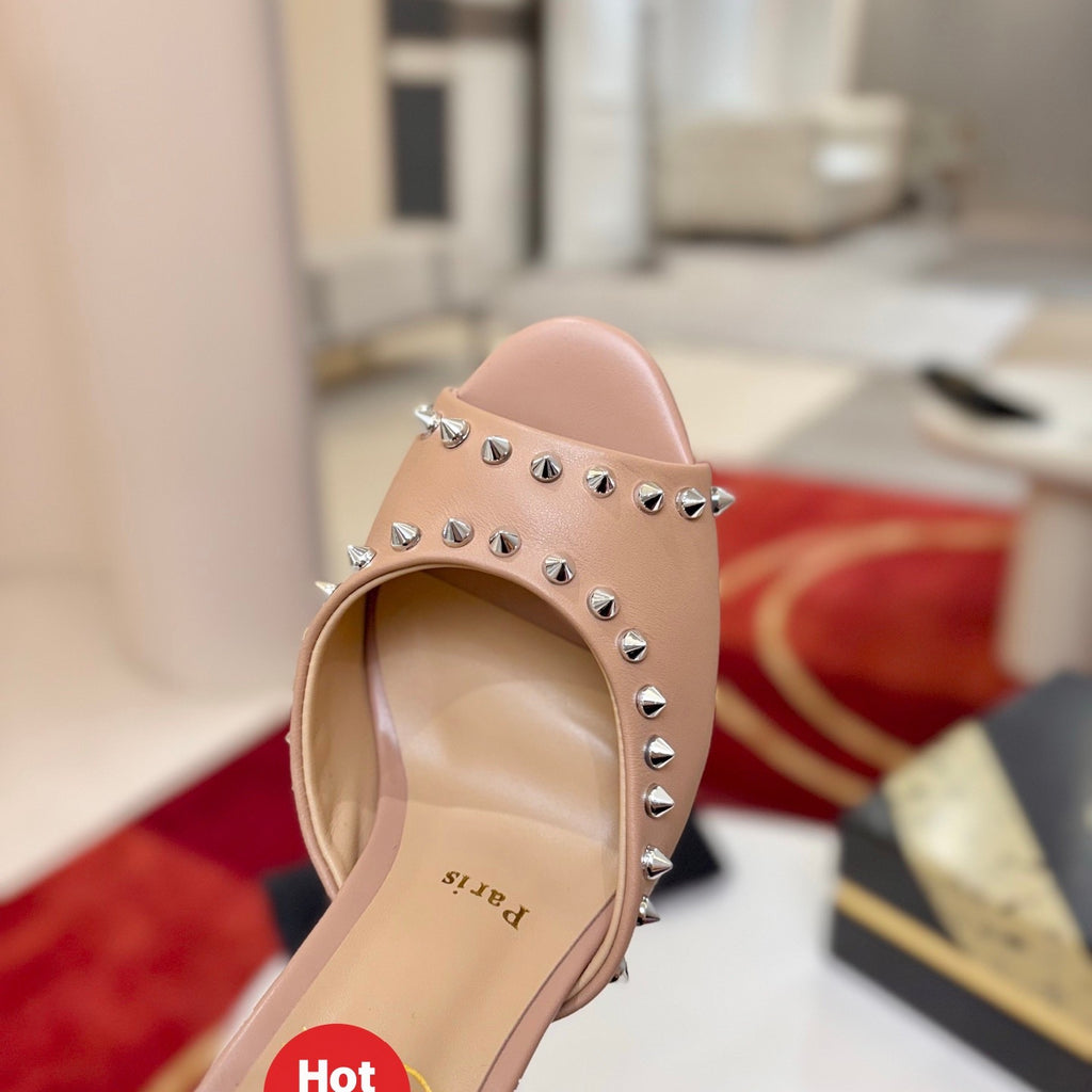 Apricot peep-toe high-heeled mules with stud detailing; 8.5cm heel.