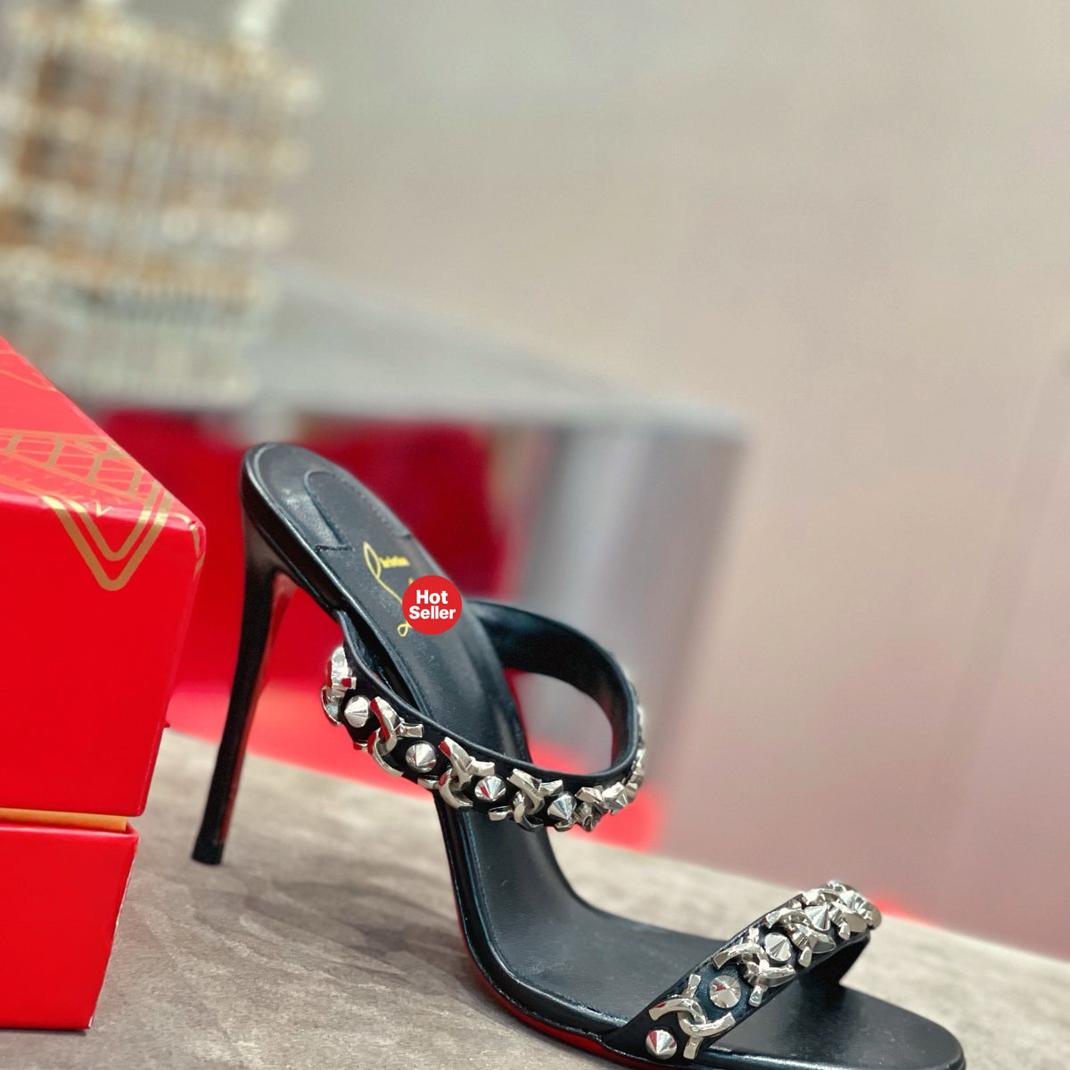 Chain-detail high-heeled mules, 10cm heel.