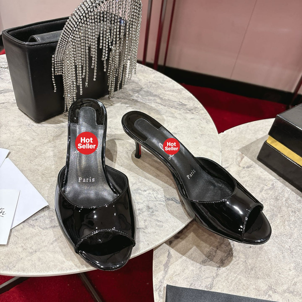 Black patent leather high-heeled mules, 8.5cm heel.
