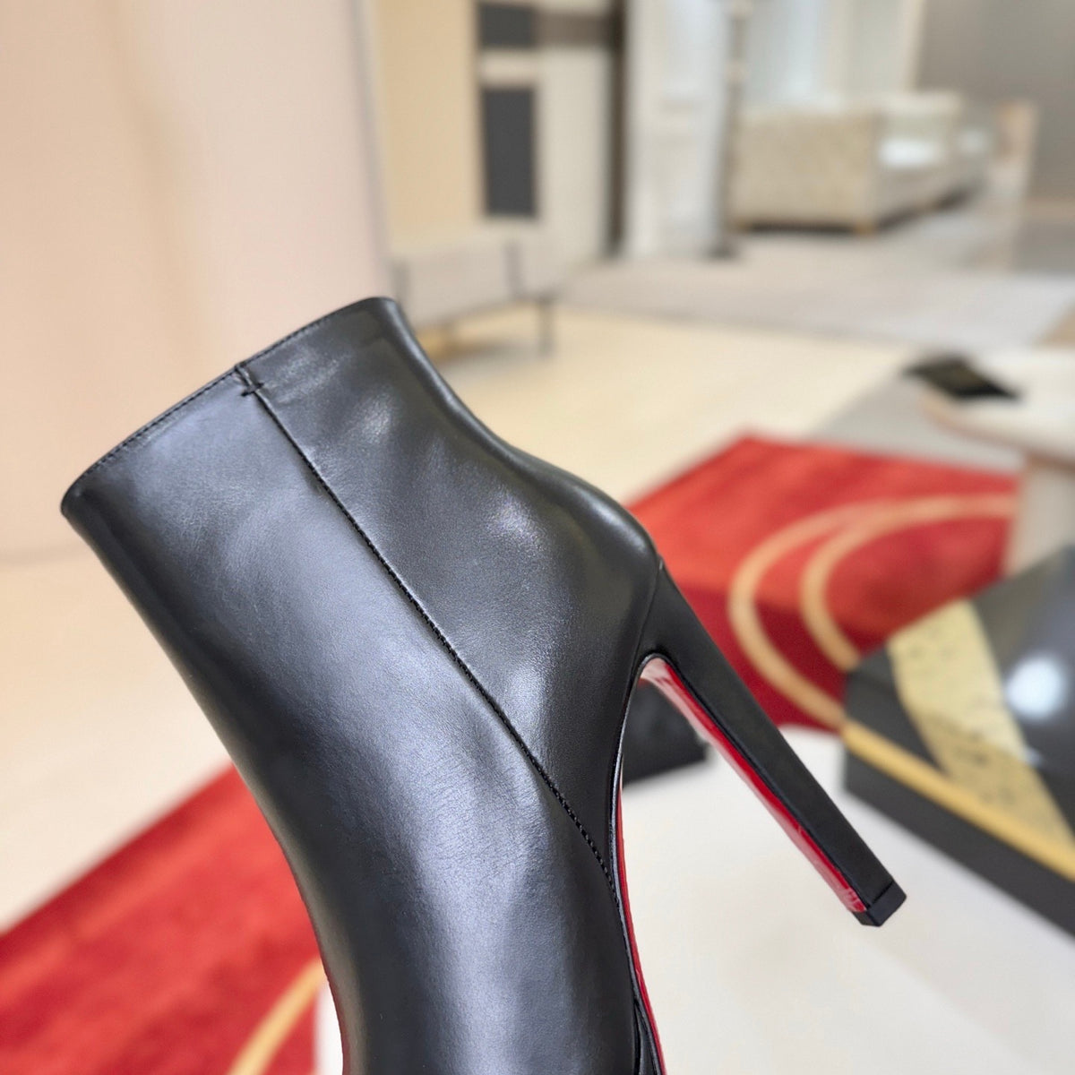 Black leather stiletto ankle boots, 12cm heel.