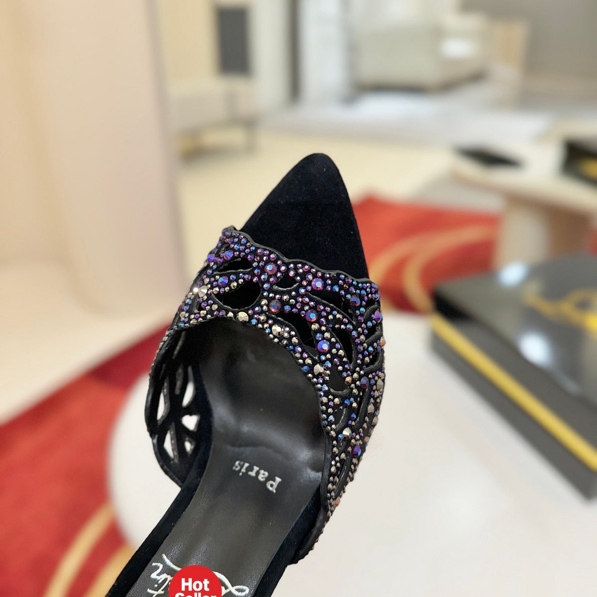 Black cutout high-heeled mules with all-over pavé crystals; 10cm heel.