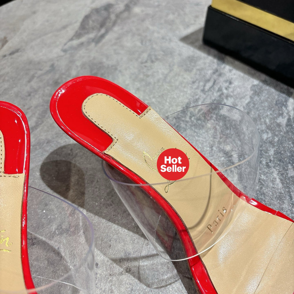 Red translucent high-heeled mules, 8.5cm heel.