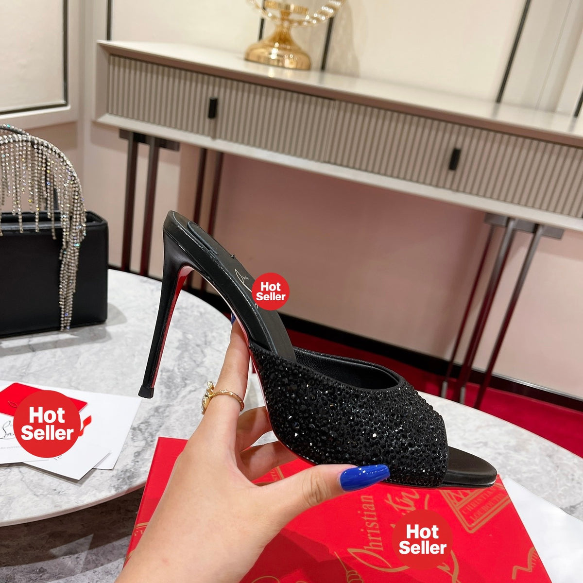 Black peep-toe high-heeled mules with rhinestone embellishment; 10cm heel.