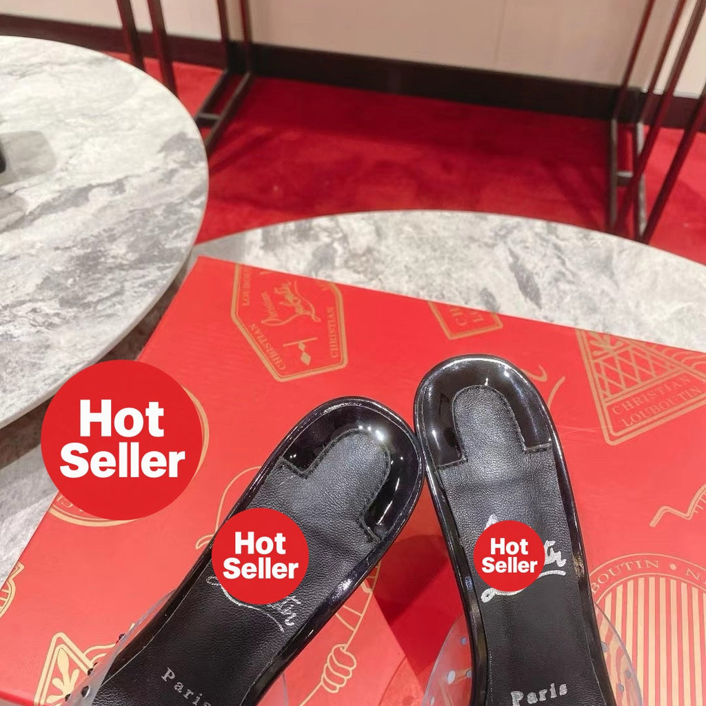 Black open-toe high-heeled mules with transparent strap detail; 8cm heel.