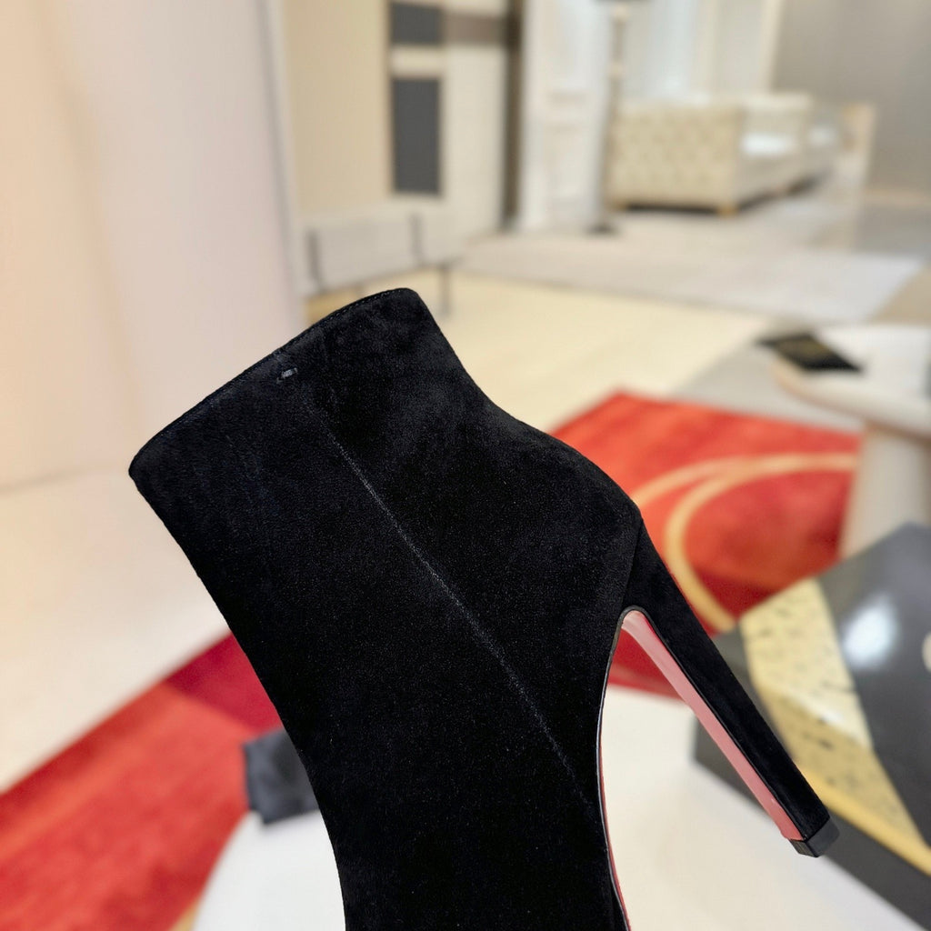 Black suede stiletto ankle boots, 12cm heel.