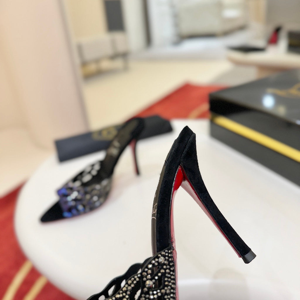 Black cutout high-heeled mules with all-over pavé crystals; 10cm heel.