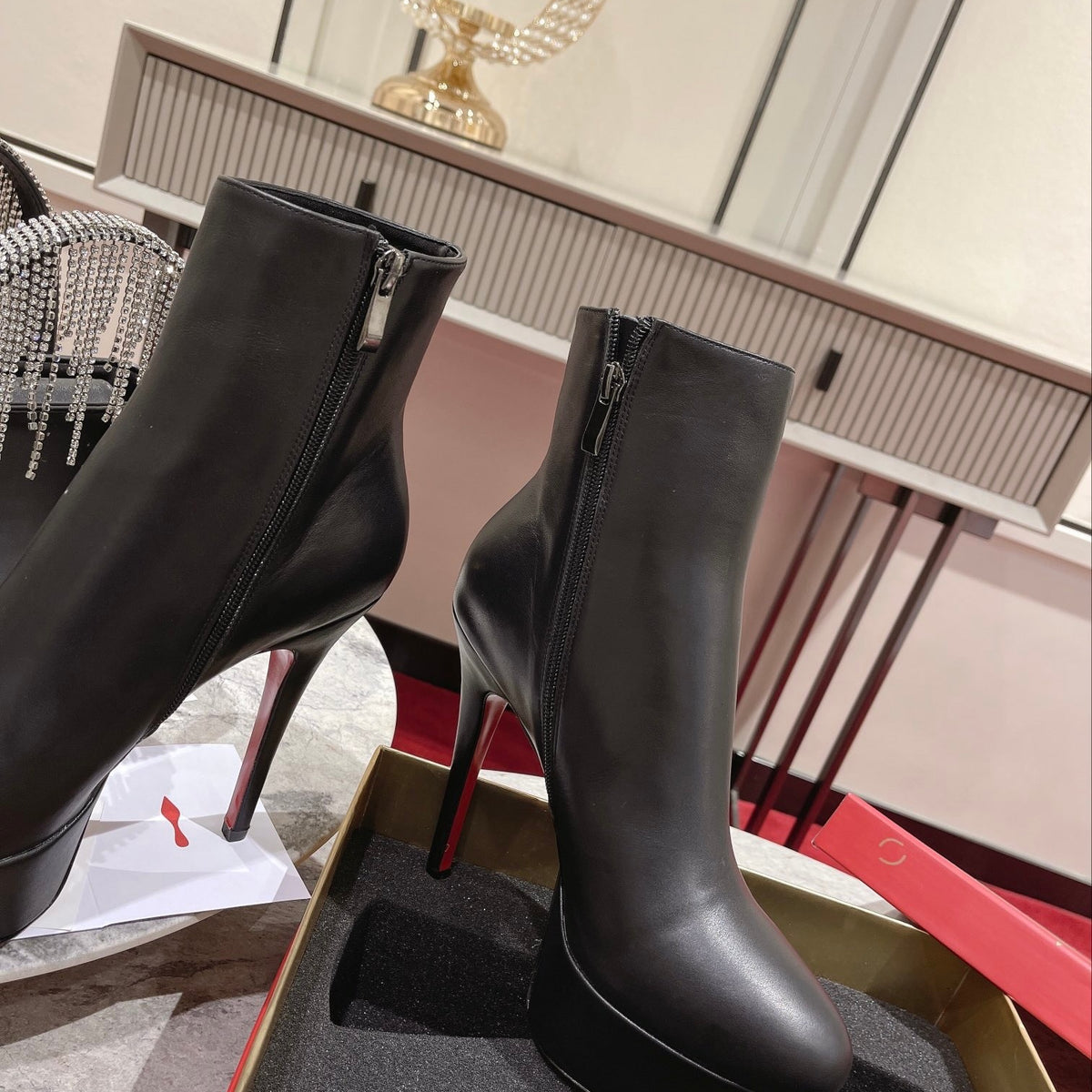 Black Nappa leather ankle boots featuring a soaring 12cm height. Heel: 13cm.
