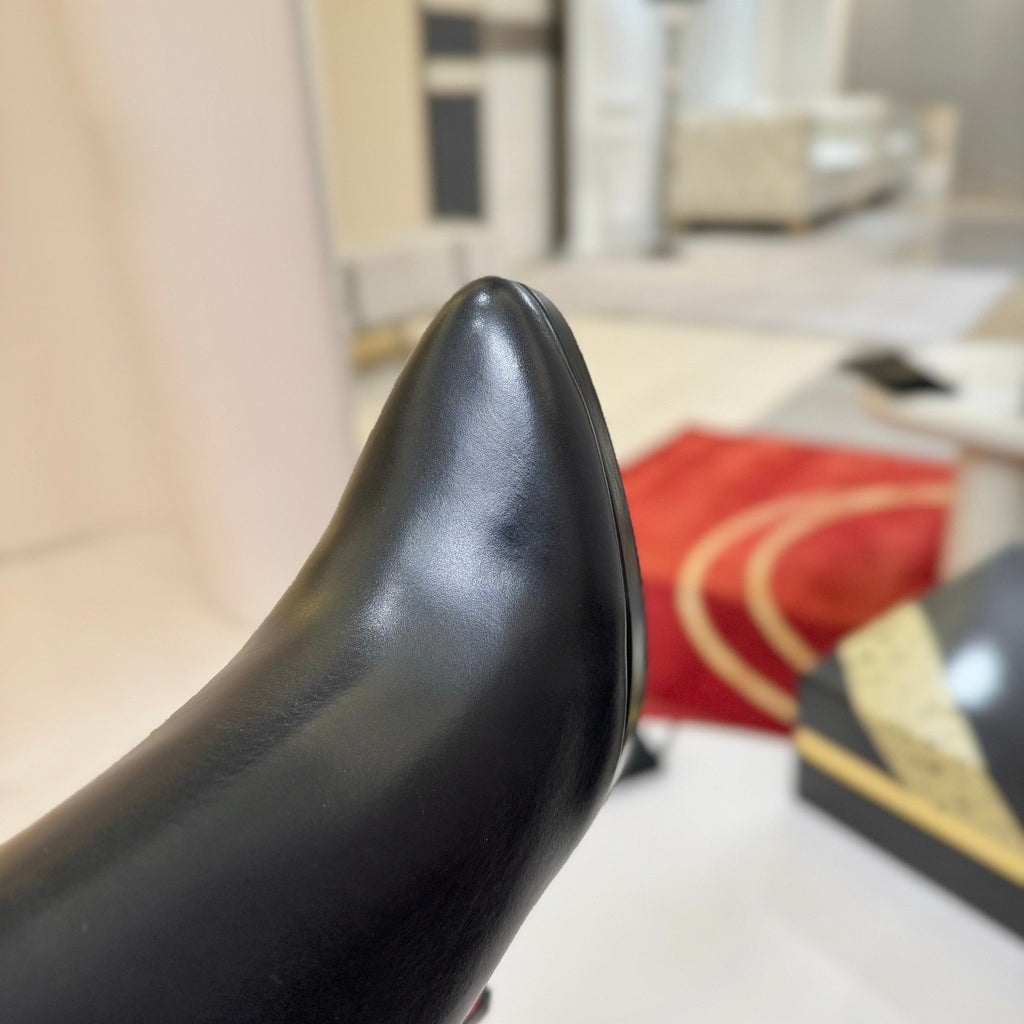 Black leather stiletto ankle boots, 12cm heel.