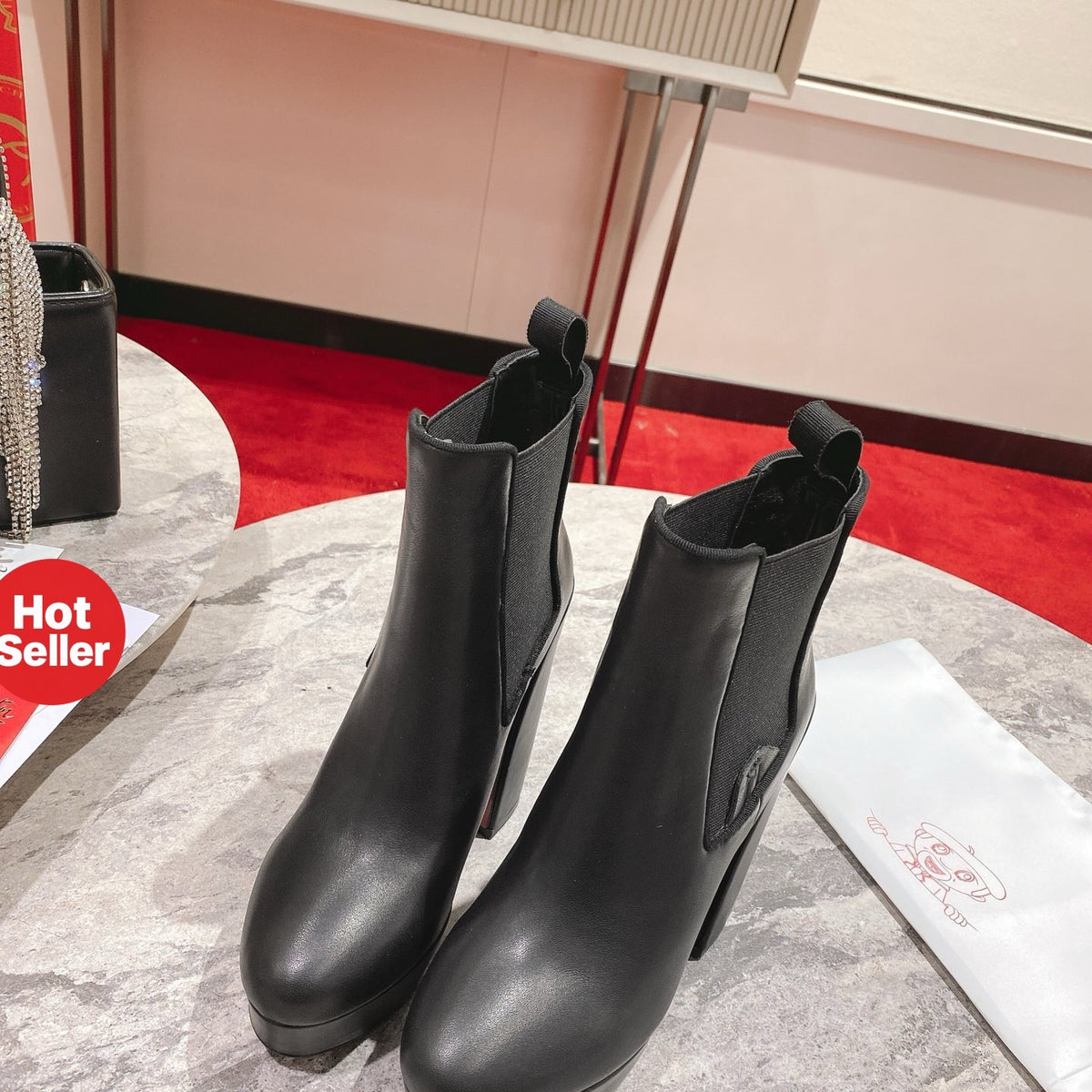 Black calfskin ankle boots with 13cm stiletto heels.