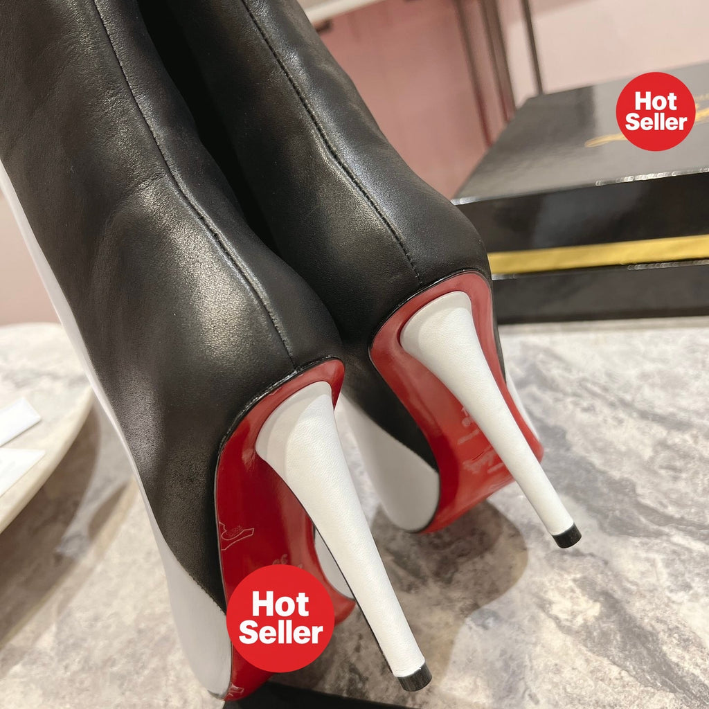 Paneled leather tall boots with a distinctive design; 10cm heel.