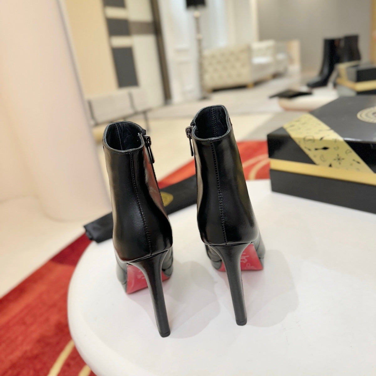 Black leather stiletto ankle boots, 12cm heel.