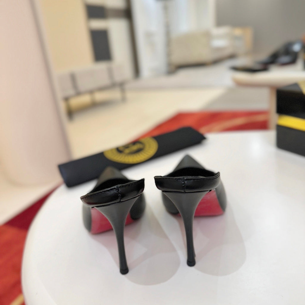 Black cowhide high-heeled mules, 10cm heel.