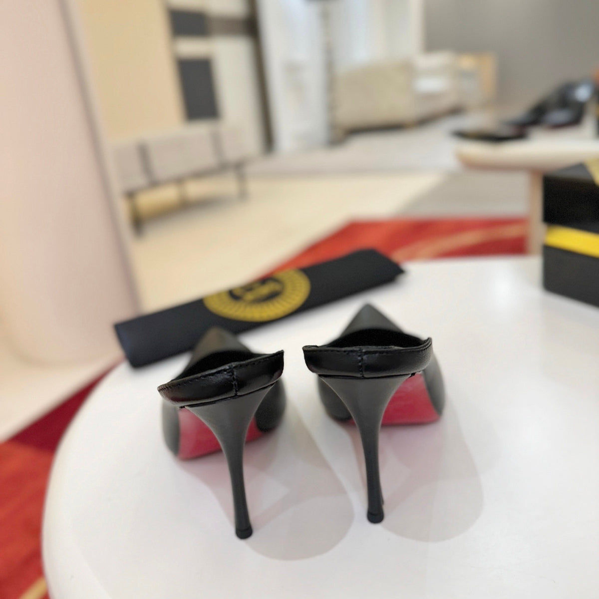Black cowhide high-heeled mules, 10cm heel.